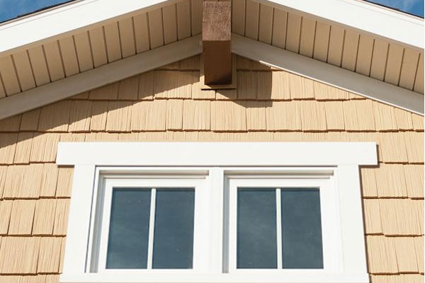 Soffit and Fascia - Tan soffit with a clean finish, highlighting professional installation by Siding & More.