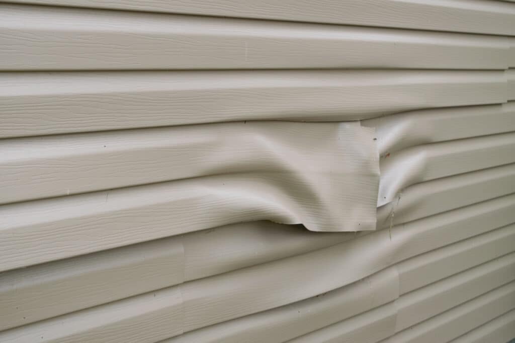 hail damage siding warped vinyl siding