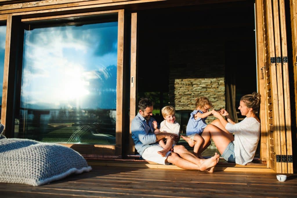 patio door family with children sitting on patio