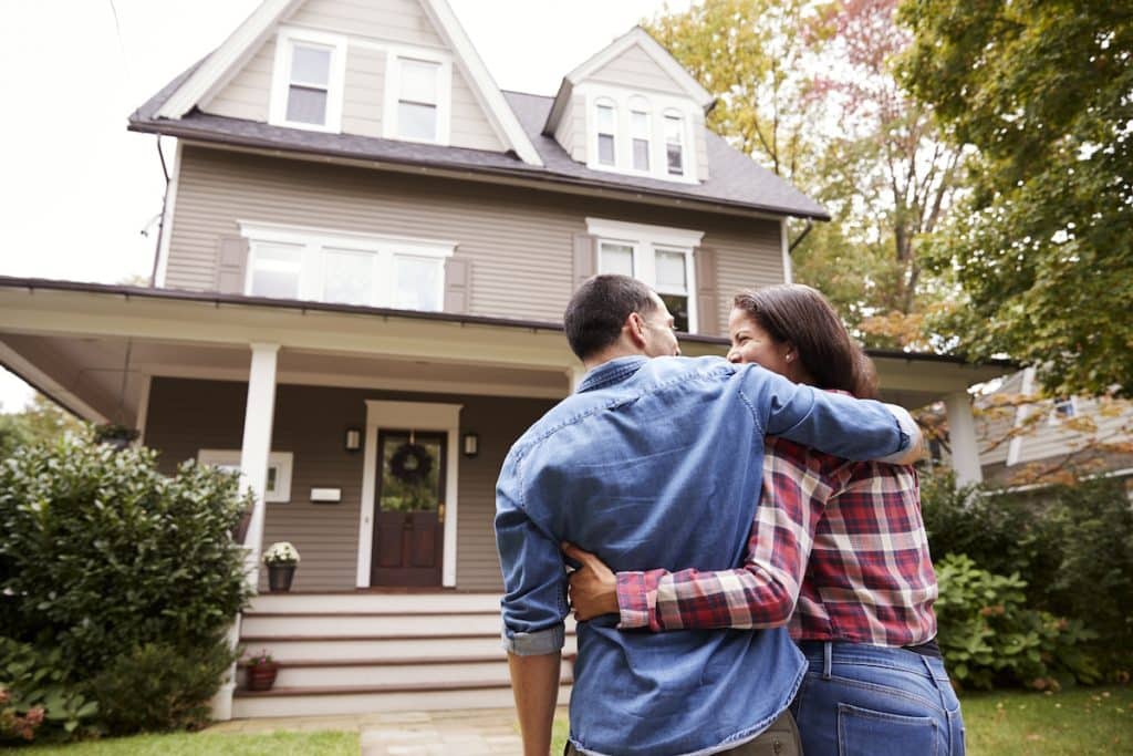house siding couple entering house
