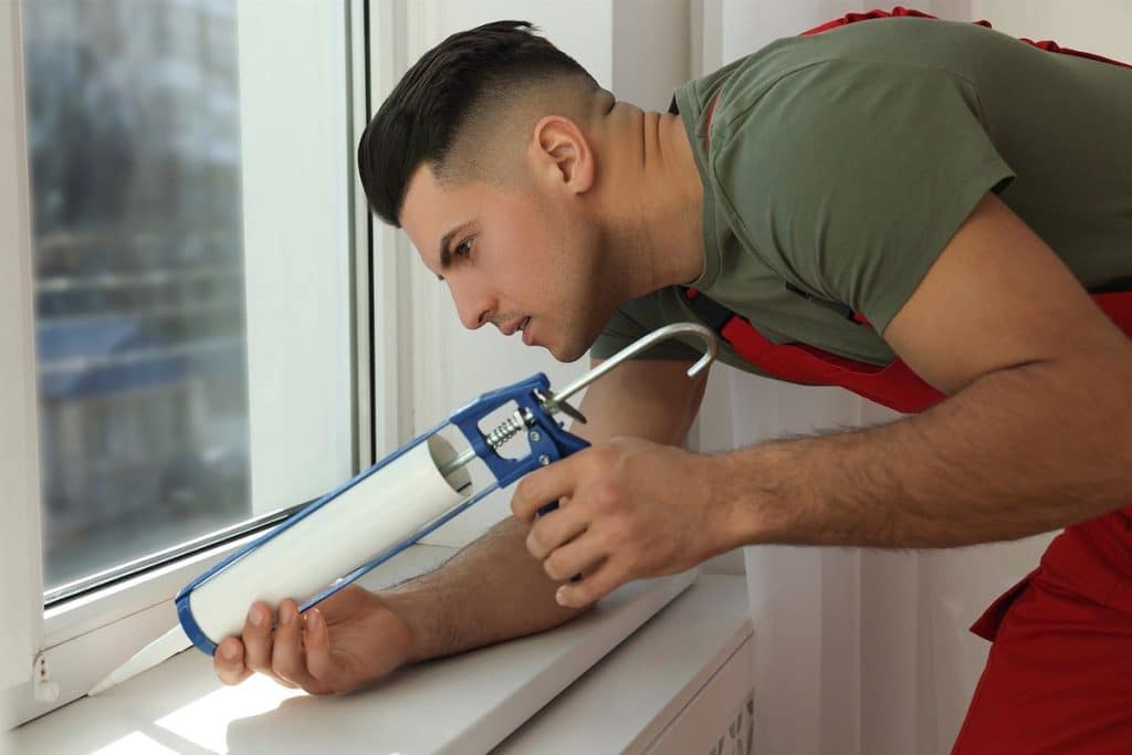 vinyl windows sealing window with caulk indoors