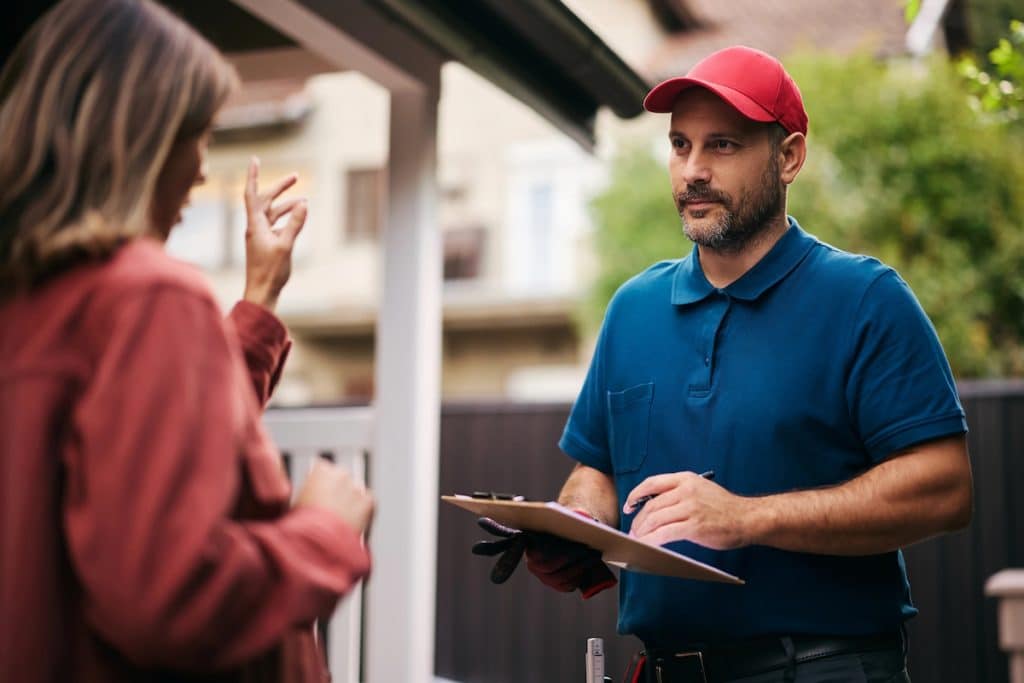 hail damage house siding sales contractor solicits homeowner